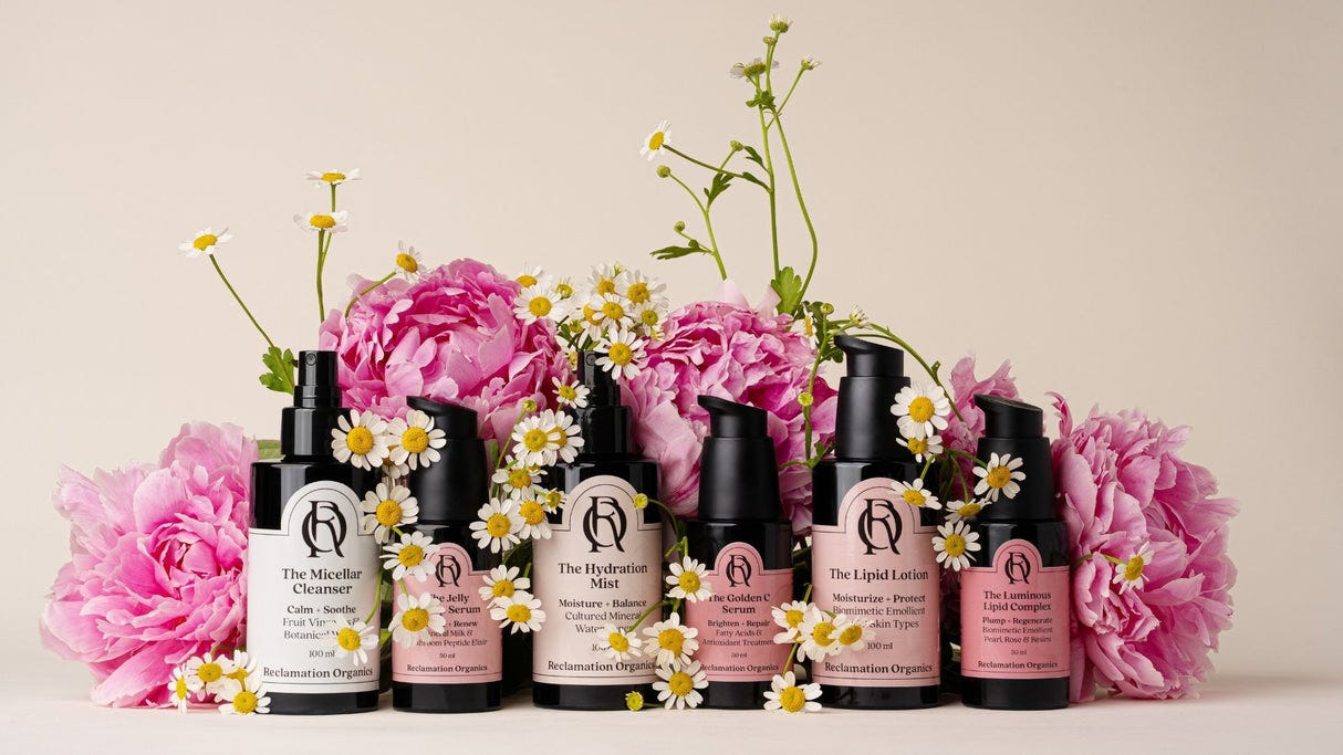Set of skincare products with floral arrangement on a light background Set of skincare products with floral arrangement on a light background