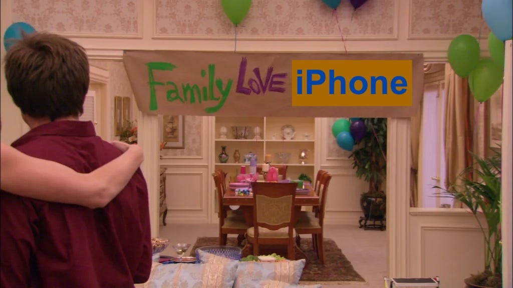 Scene from Arrested Development where the Bluths reveal the "Family Love Michael" banner, with "Michael" replaced by the word "iPhone"
