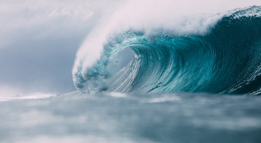 white and blue ocean waves