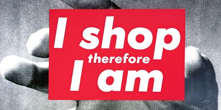 This may contain: a person holding up a sign that says i shop, therefor i am on it