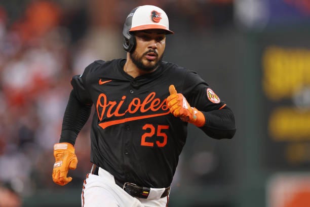 Anthony Santander of the Baltimore Orioles advances to third base on a fielder's choice against the Kansas City Royals hit by Ryan O'Hearn during the...