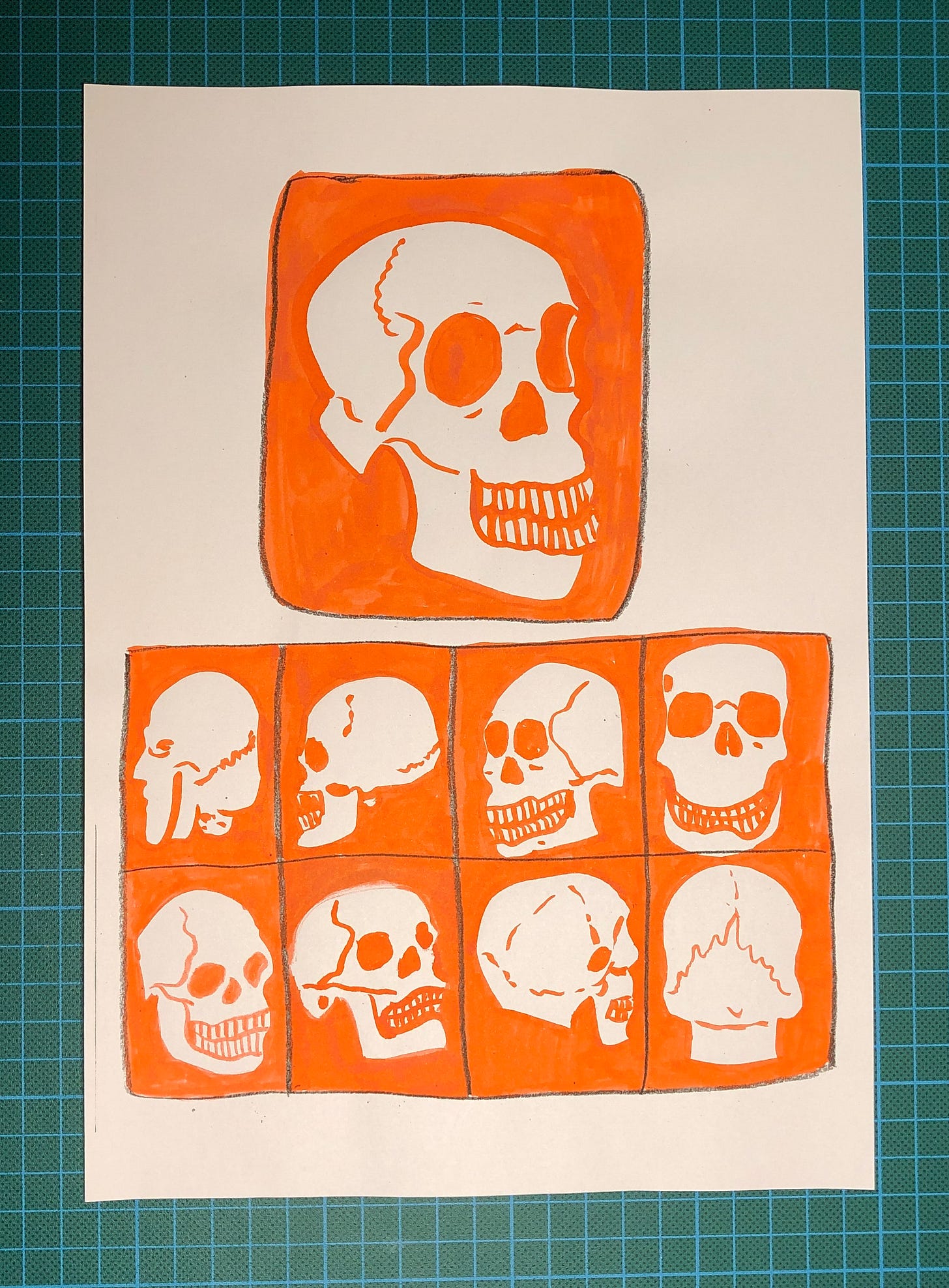 Photo de la feuille A4 sur laquelle j'ai dessiné 9 crâne dans des cases.