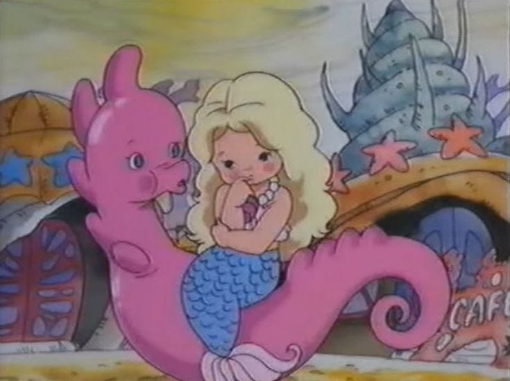 This may contain: the little mermaid and her pink dragon are in front of a sign that says cafe This may contain: the little mermaid and her pink dragon are in front of a sign that says cafe