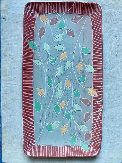 unfired clay beakers, tray, mugs and plates