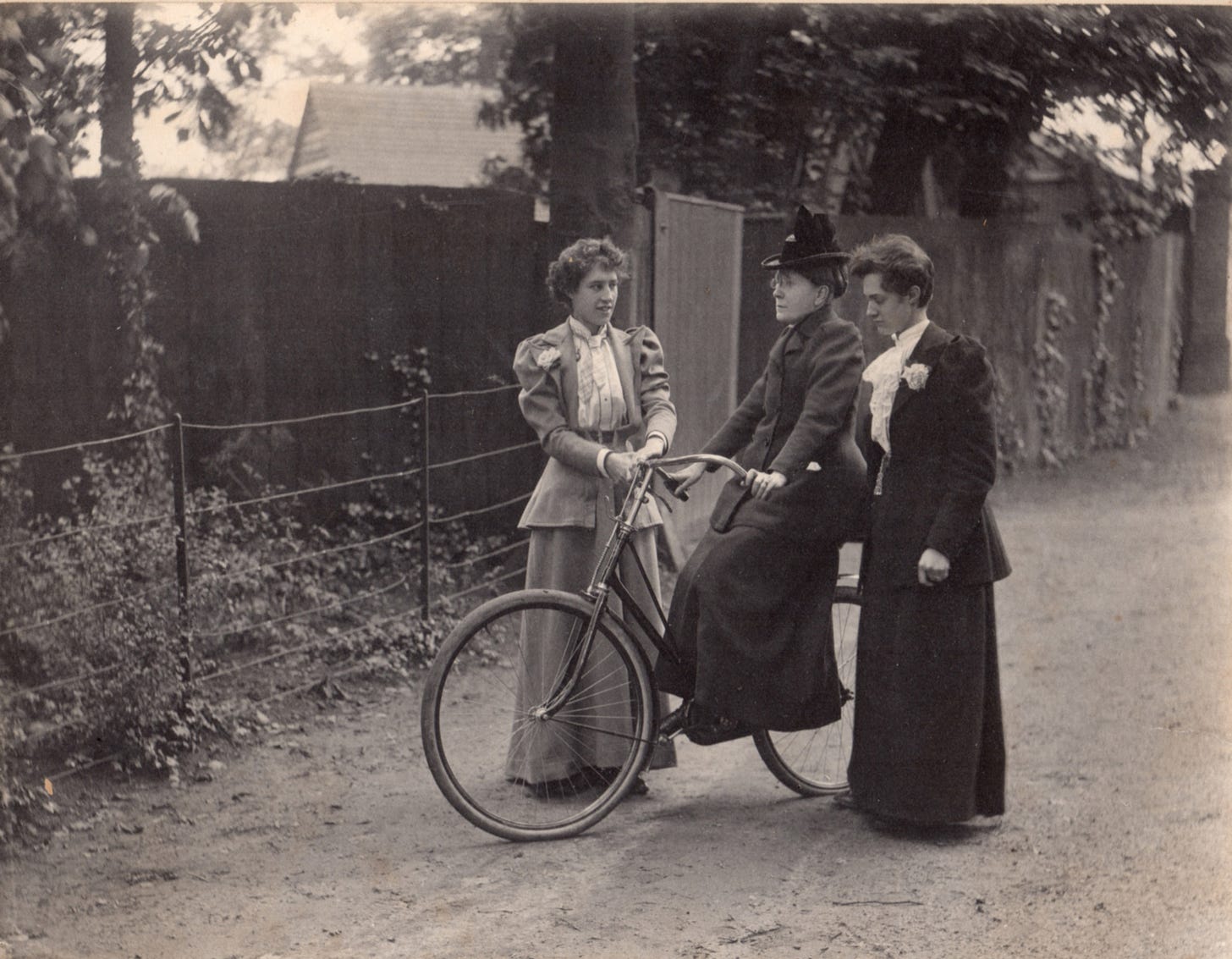 Social reformer Frances Willard, 53, receives help from two assistants during her 6-week process of learning to ride a bicycle to improve her health.
