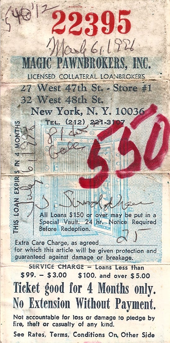 Scanned image of a pawn ticket from Magic Pawnbrokers, Inc, 47th St NYC. There are notations on it in black pen, including my name and the date March 6, 1996, and in bold red marker, the number 550. The ticket is worn, dirty and creased -- as you would expect from a piece of card stock kept in a wallet for more than 10 years.