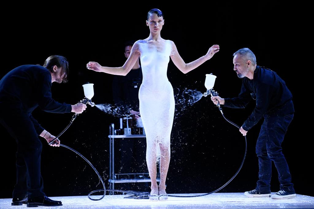 Bella Hadid gets dress spray-painted on mid-fashion show