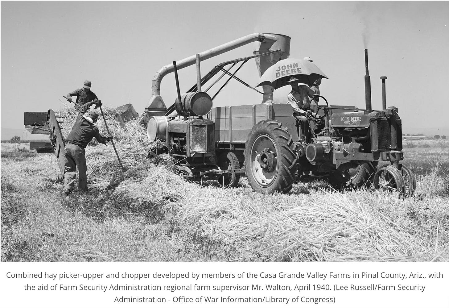 a combined hay picker-upper and chopper at work on a field in the Casa Grande Valley Farm in Pinal County, Arizona.