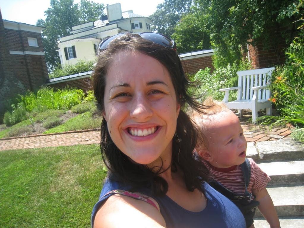 A woman holding a baby in Virginia before she burned out