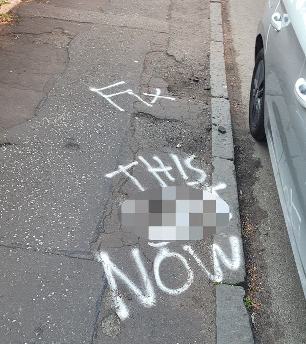 Graffiti criticising the state of the pavement was sprayed on Lochleven Road in Battlefield.