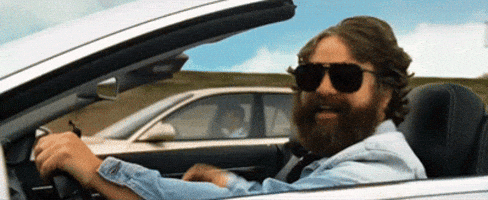 Movie gif. Zach Galifianakis as Alan in The Hangover 3, driving by in a convertible, give us a thumbs up. Movie gif. Zach Galifianakis as Alan in The Hangover 3, driving by in a convertible, give us a thumbs up.