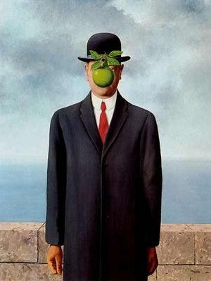 A person in a suit and tie with a green apple over his face
Description automatically generated