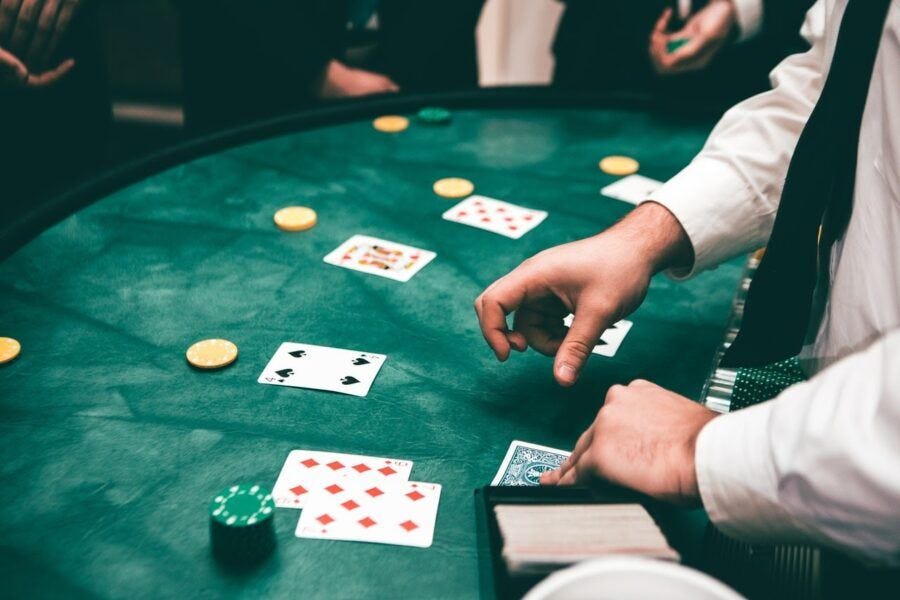 croupier serving cards to people playing 2020 croupier serving cards to people playing 2020