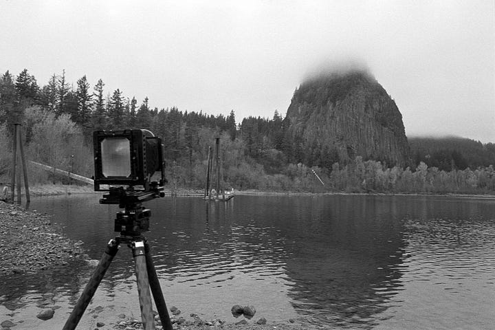 4x5 Camera set up aimed at a large rock formation, then the image it created