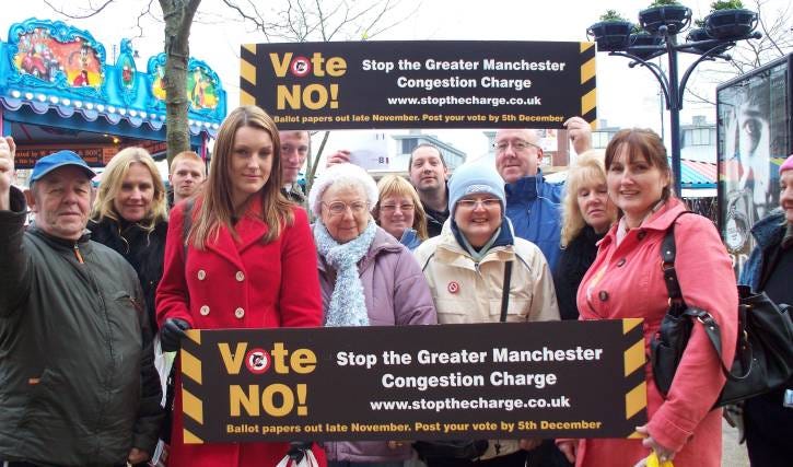 a picture showing people demonstrating against the manchester congestion charge