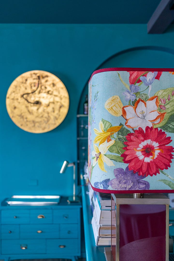 Lido 84's interior is bathed in a deep teal with eclectic Italian touches.