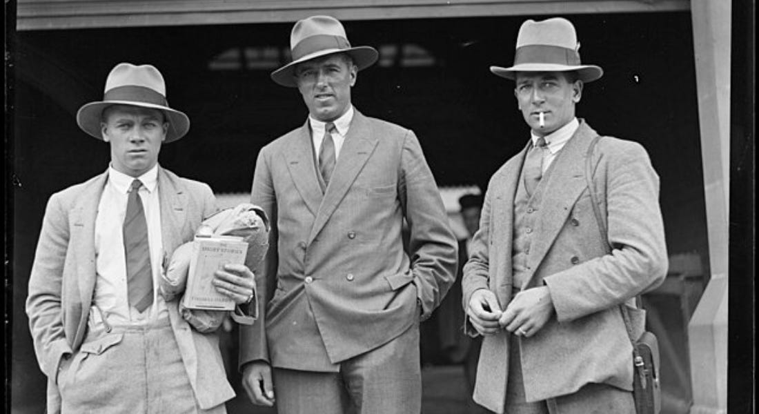 Three men in hats and suits: George Duckworth, George Geary and Harold Larwood