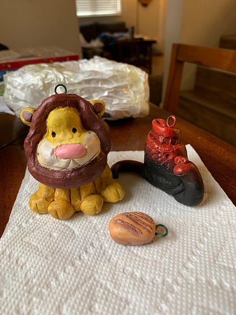 hand crafted ornaments for 2023 by Kayla Stark and Brad Henderson of a lion and a snail
