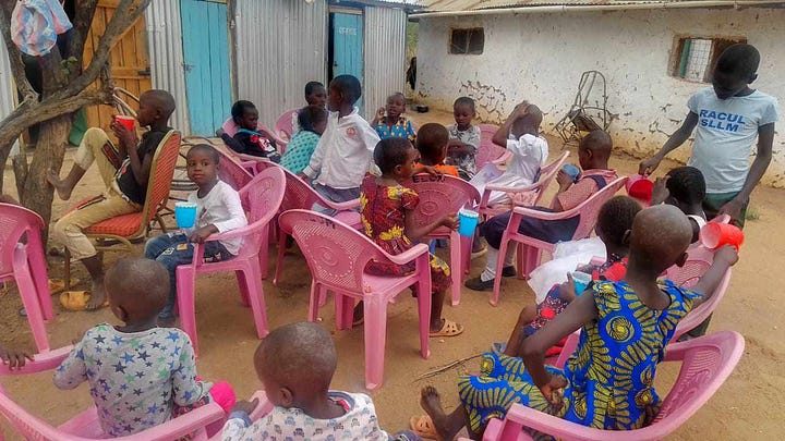 photos of the bishop and the children in rural Kenya