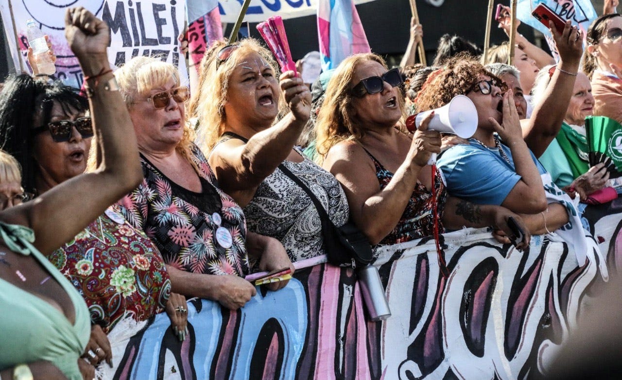 A group of people protesting
AI-generated content may be incorrect. A group of people protesting
AI-generated content may be incorrect.