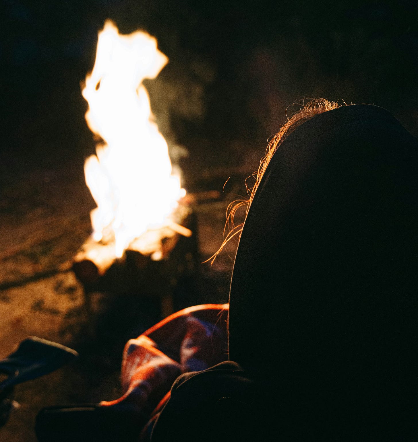 Woman watching fire Woman watching fire