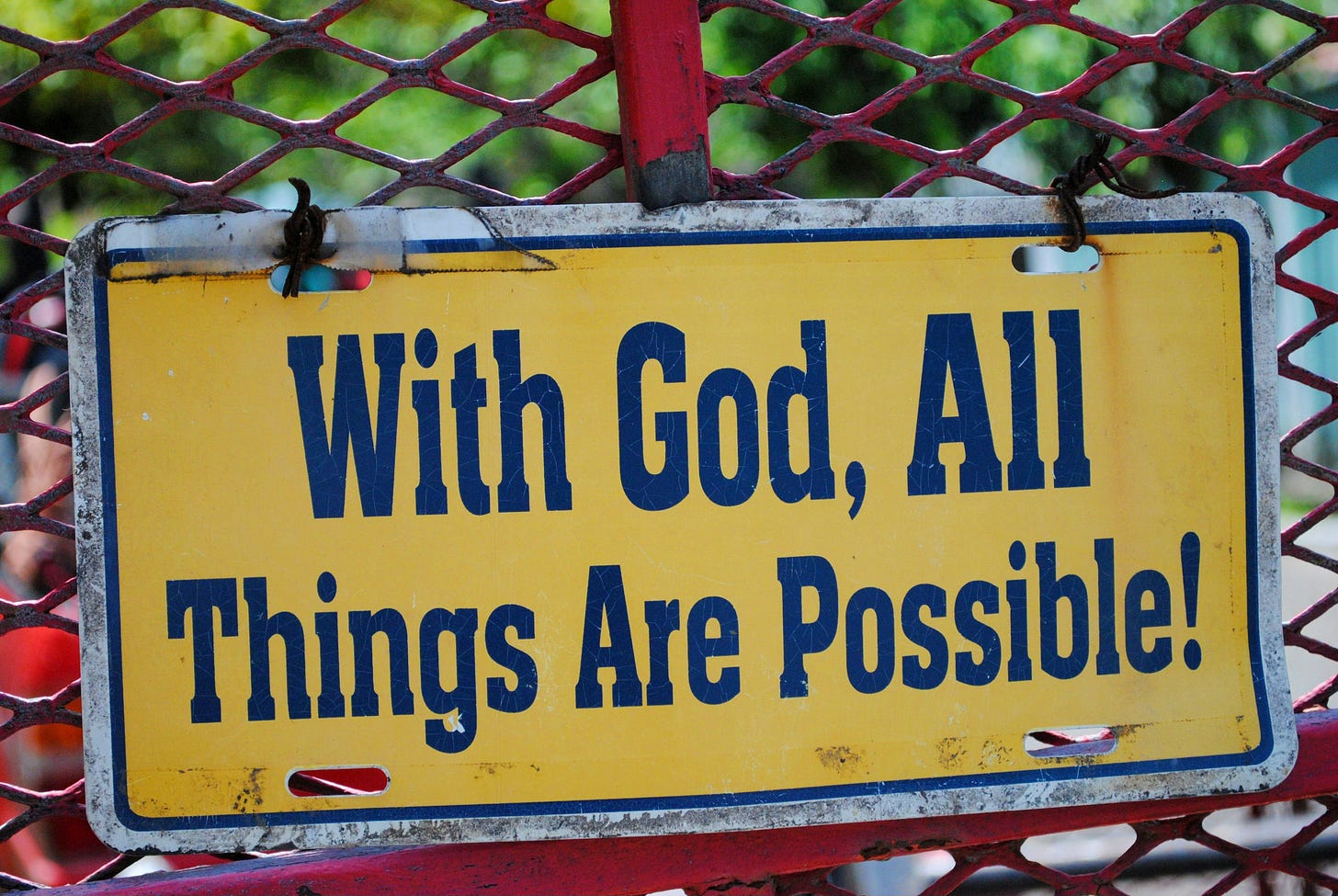 a sign saying 'With God, all things are possible!' a sign saying 'With God, all things are possible!'
