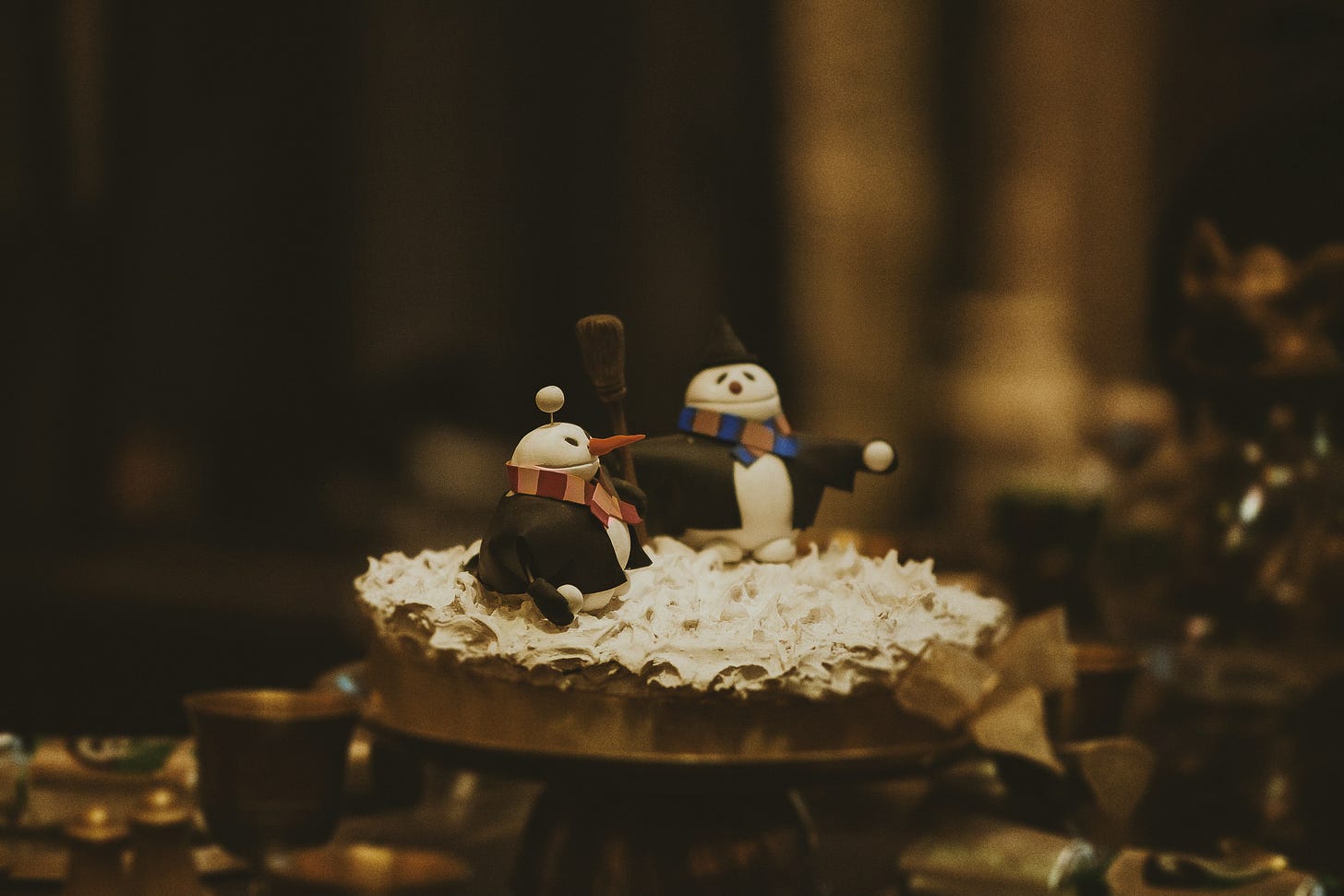 two figures on a cake
