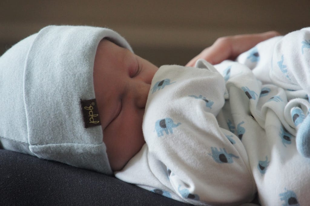 Sam snoozing in his momma's lap at the hospital. Two days old! Sam snoozing in his momma's lap at the hospital. Two days old!