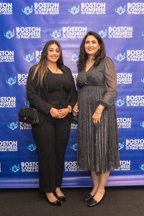 Harneet K. Cheema, BSc, MD Candidate, on the BCPH backdrop beside a family member.