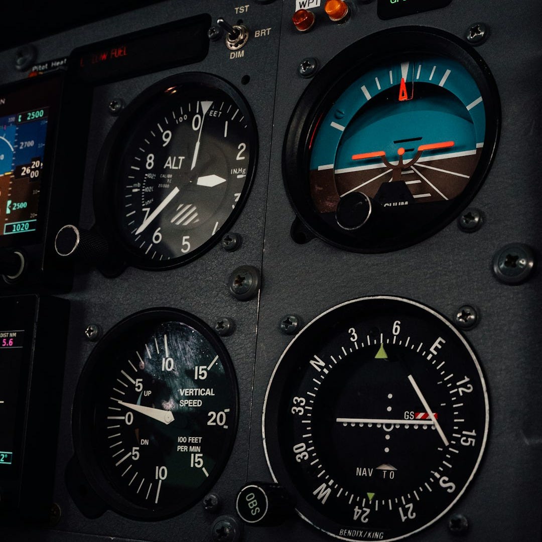 A close up of a plane cockpit with many gauges A close up of a plane cockpit with many gauges