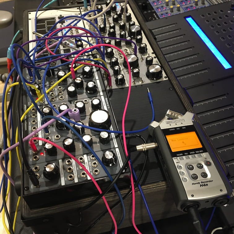 Photo of wires connecting modular synthesizers together. Photo of wires connecting modular synthesizers together.