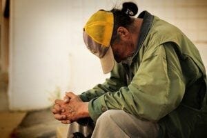 Man sitting with his head down