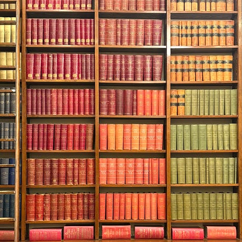 Three images in a row. The first is a shelf of colourful books from the South Australian Parliamentary Library. The second is a screenshot from the new Pink Shorts Press website landing page. The third is a series of outfits on display at the AGSA Radical Textiles exhibition.