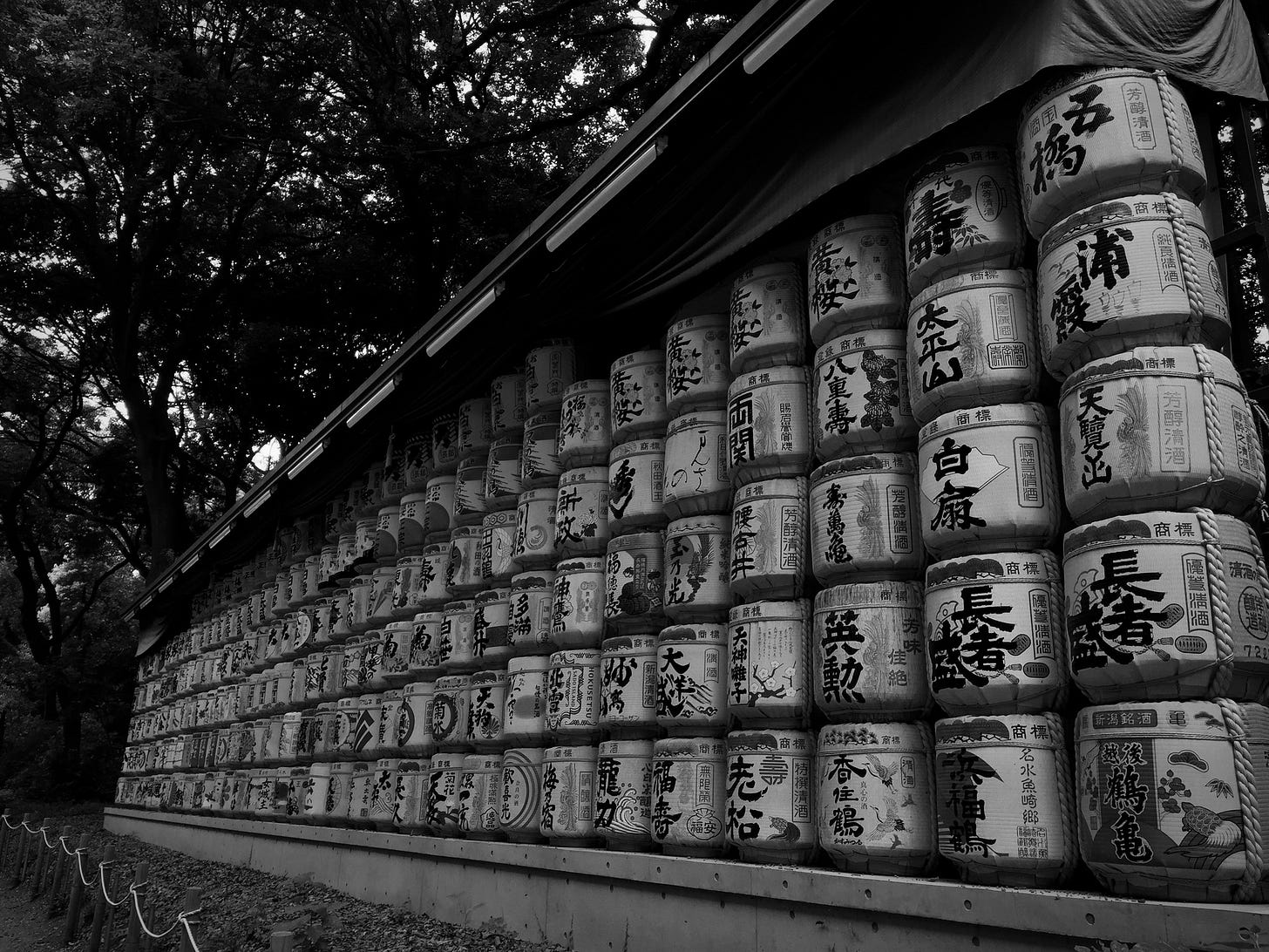 black and white photo of the rice barrels at the Meiji garden and shrine, Tokyo Japan) black and white photo of the rice barrels at the Meiji garden and shrine, Tokyo Japan)