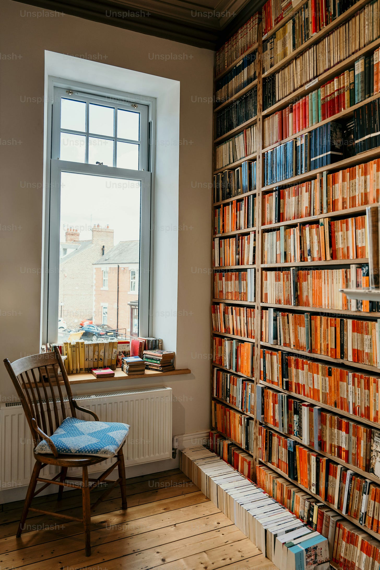 Cozy library corner with tons of books.