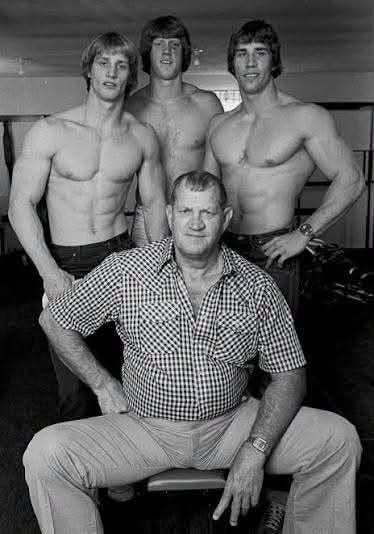 May be a black-and-white image of body building May be a black-and-white image of body building