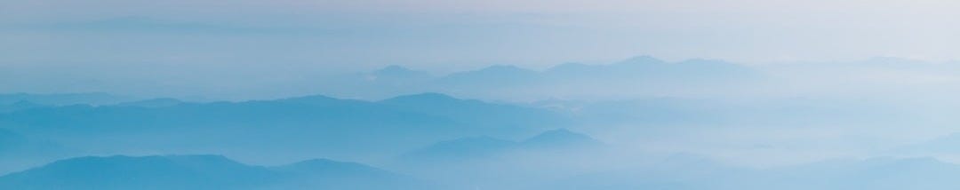 mountain covering with clouds