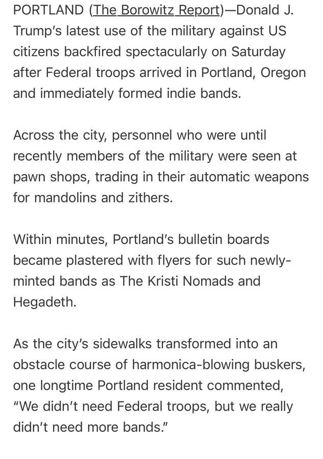 Two men sitting on a bench against a brick wall, each holding an acoustic guitar. A flyer with a skull design wearing sunglasses, chains, and flames, labeled "Hegadeth" in bold text.