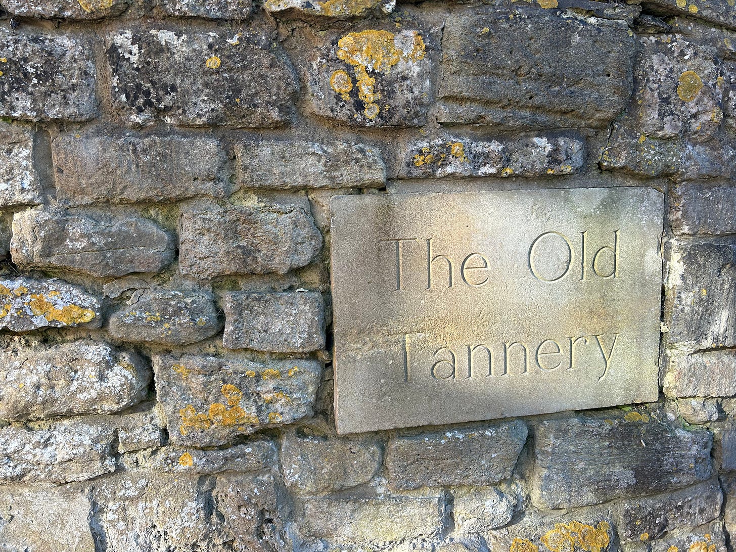 A sign, The Old Tannery, inset into a stone wall. Photo: Roland Millward A sign, The Old Tannery, inset into a stone wall. Photo: Roland Millward