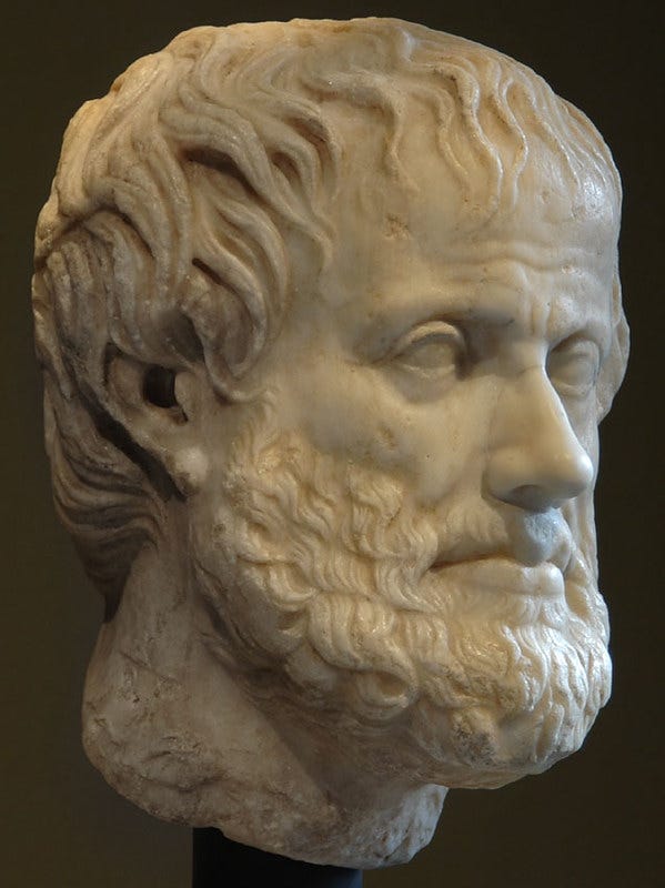 A stone rendition of the bearded head of Aristotle. A stone rendition of the bearded head of Aristotle.