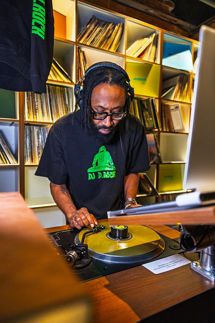 DJ Color and Black and White At a Record and Audio Console.