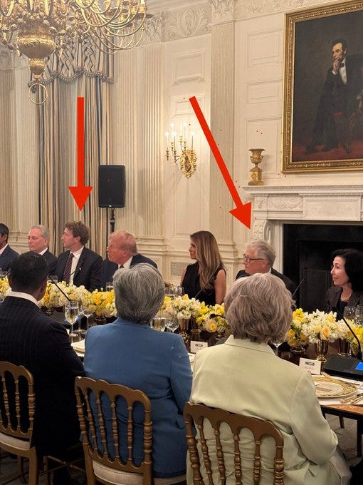 Donald Trump, Mark Zuckerberg, Bill Gates, and Melania Trump seated at a long dining table in a grand room. The table is adorned with yellow floral centerpieces, wine glasses, and plates. Ornate chandeliers, a large portrait, and a fireplace are visible in the background. Red arrows point to Mark Zuckerberg and Bill Gates.
