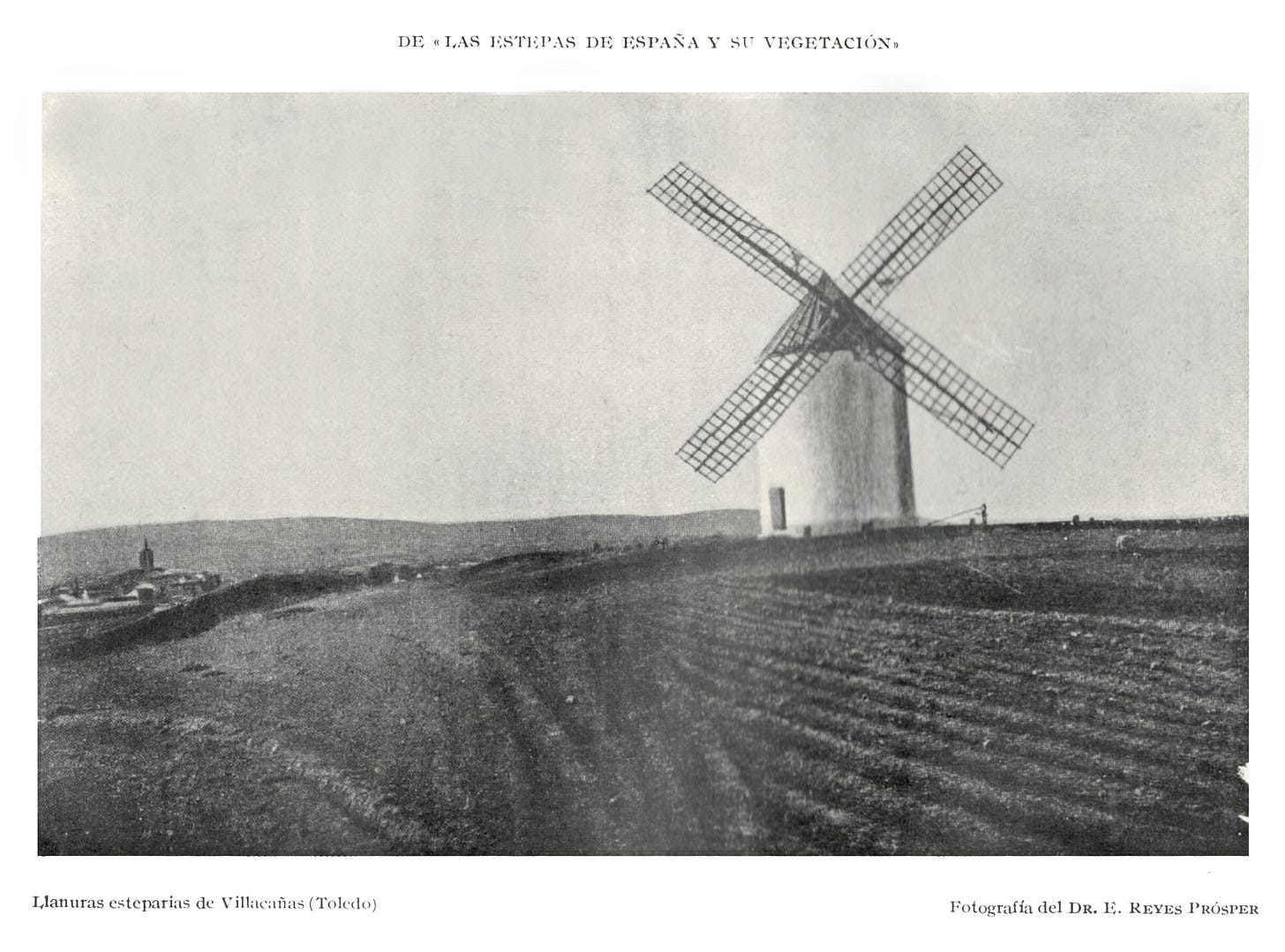 Black and white 1916 photograph of a windmill on the empty plains of Villacañas, Toledo, in Castilla-La Mancha, Spain.