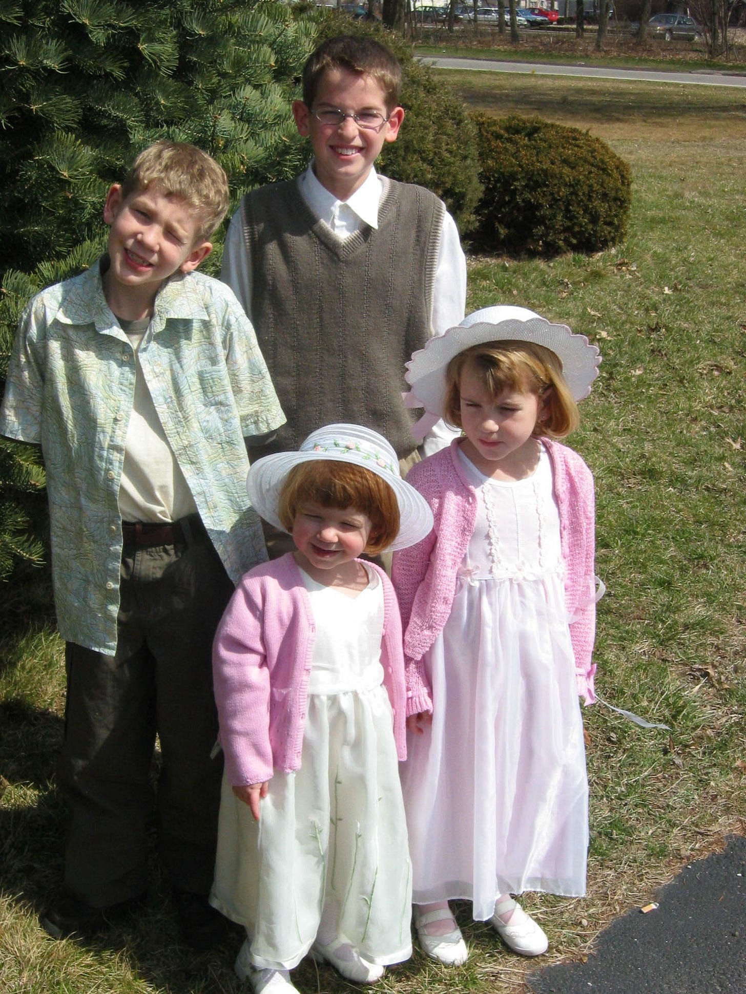 Author's four children, two young boys and two little girls, dressed in their Easter best.