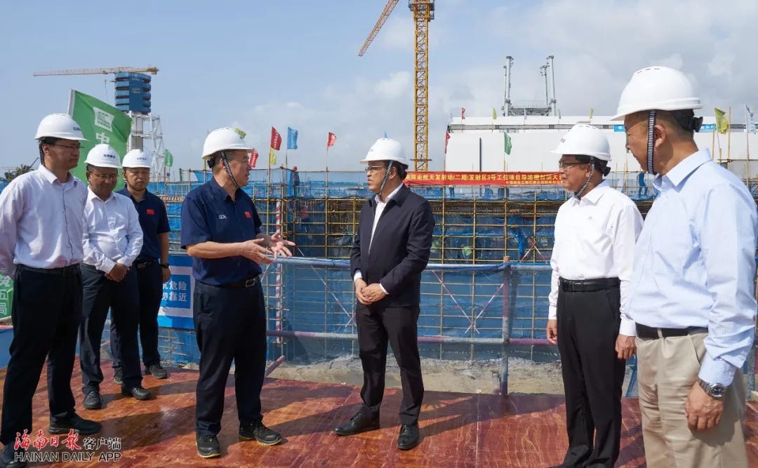 Feng Fei (center) stood atop of launch pad construction work during his visit to the Wenchang Commercial Space Launch Site. Feng Fei (center) stood atop of launch pad construction work during his visit to the Wenchang Commercial Space Launch Site.