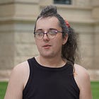 A Laramie bartender faces felony charges after pulling a gun downtown. She says it was self-defense amid a volley of anti-queer slurs.