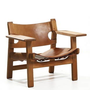 BORGE MOGENSEN "SPANISH" CHAIR FOR FREDERICIA STOLEFABRIK, SADDLE LEATHER AND OAK: Dimensions Height 24 3/8 in. (62 cm), Seat height 12 3/16 in. (31 cm), Width 32 5/16 in. (82 cm) Description Designed in 1958 by Danish designer Børge Mogensen for Fredericia Stolefabrik, the BORGE MOGENSEN "SPANISH" CHAIR FOR FREDERICIA STOLEFABRIK, SADDLE LEATHER AND OAK: Dimensions Height 24 3/8 in. (62 cm), Seat height 12 3/16 in. (31 cm), Width 32 5/16 in. (82 cm) Description Designed in 1958 by Danish designer Børge Mogensen for Fredericia Stolefabrik, the