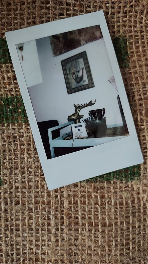 A collage of instant photographs of coffee mugs or a bald, bearded, white man drinking coffee.