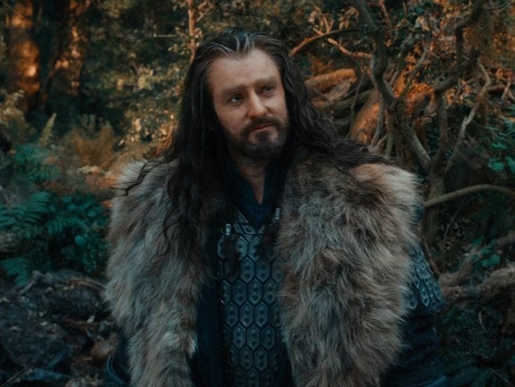 This may contain: a man with long hair wearing a fur coat