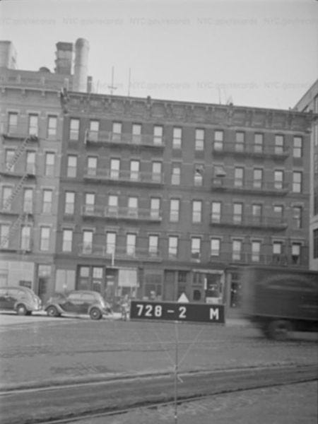 A truck driving down the street

Description automatically generated